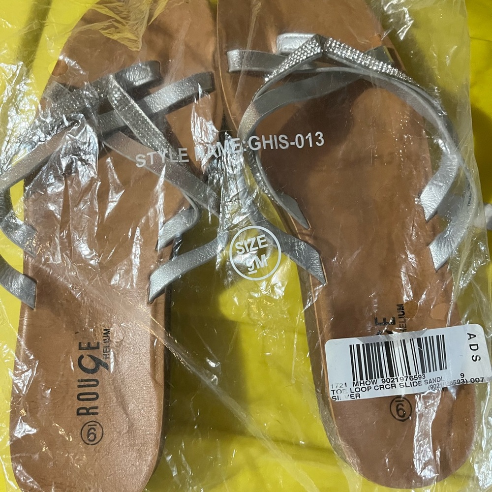Sliver sandals with rhinestones on them size 9